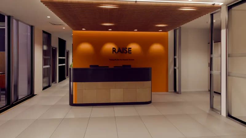 Office reception at dusk with orange feature wall